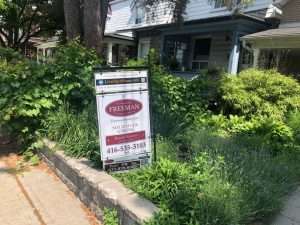 Toronto home with "for sale" sign